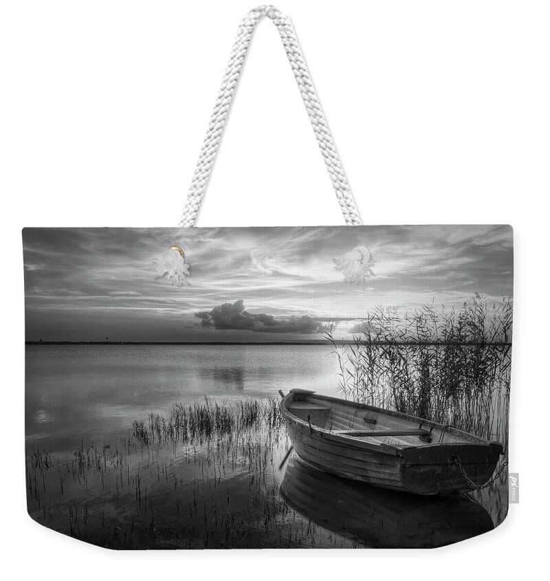 Boats Weekender Tote Bag featuring the photograph Wooden Rowboat at Sunset Black and White by Debra and Dave Vanderlaan
