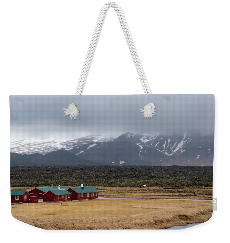 Iceland Weekender Tote Bag featuring the photograph Wooden vacation cottage houses by Michalakis Ppalis