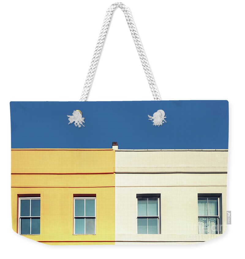 Architecture Weekender Tote Bag featuring the photograph Yellow house, white house and blue sky. by Jane Rix