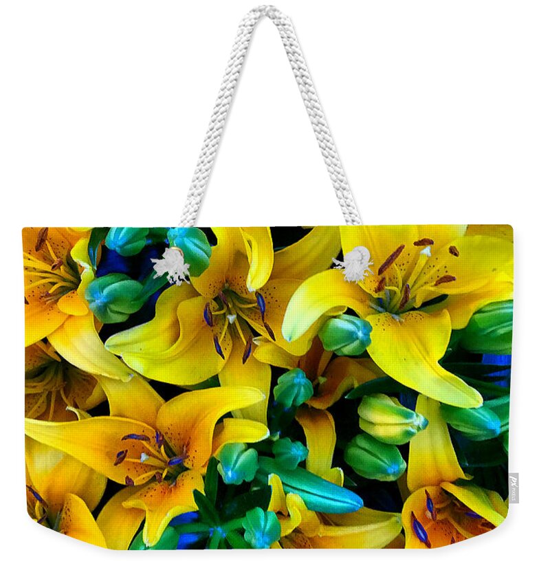  Weekender Tote Bag featuring the photograph Yellow lilies by Stephen Dorton