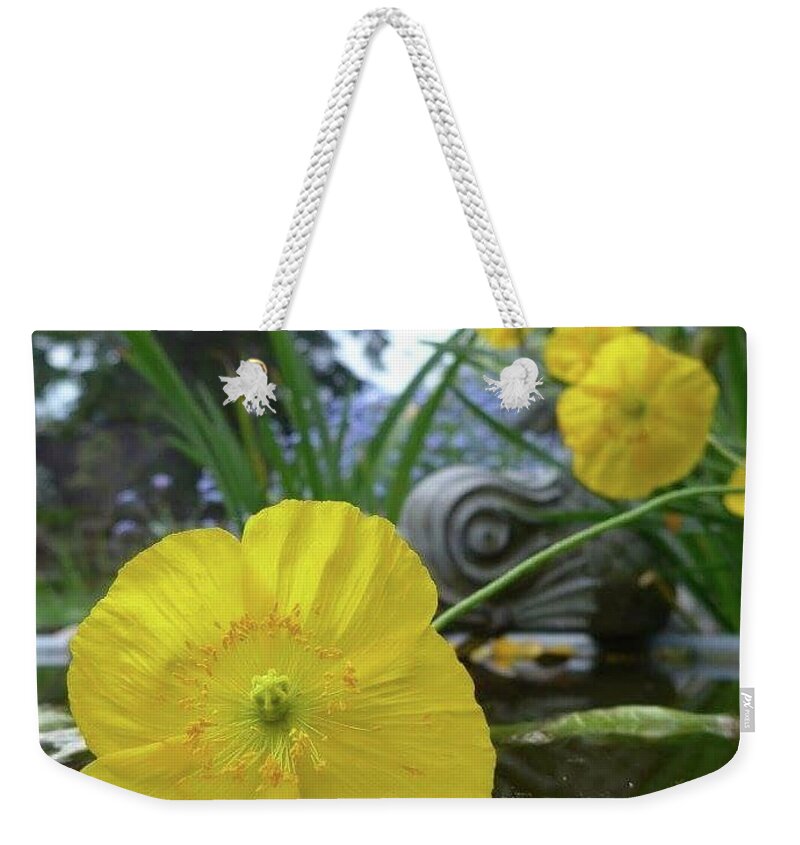 Yellow Weekender Tote Bag featuring the photograph Yellow poppy in a pool by Lisa Mutch