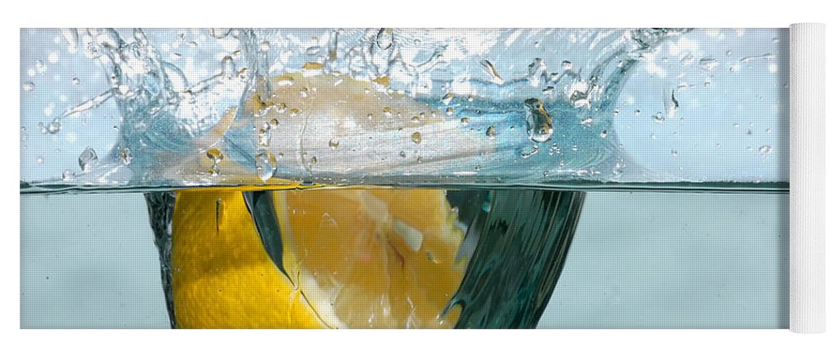 Aqua Yoga Mat featuring the photograph Lemon splash into water #1 by Michal Bednarek