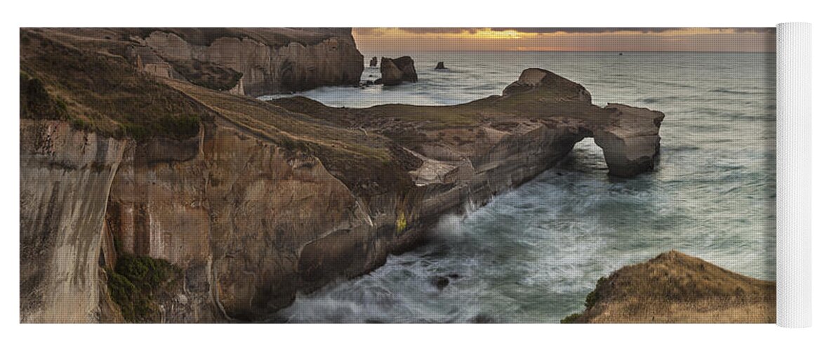 Colin Monteath Yoga Mat featuring the photograph Cliffs And Tunnel Beach Otago New by Colin Monteath