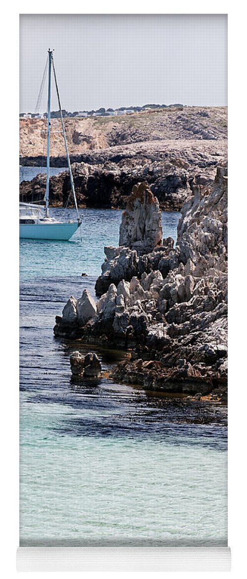 Bay Yoga Mat featuring the photograph In Cala Pudent Menorca the Cutting rocks in contrast with turquoise sea show us an awsome place by Pedro Cardona Llambias