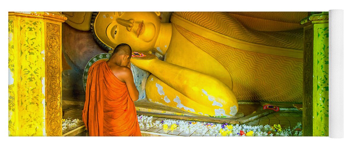 Temple Yoga Mat featuring the photograph praying buddhist monk by a lying buddha in Sri Lanka by Gina Koch