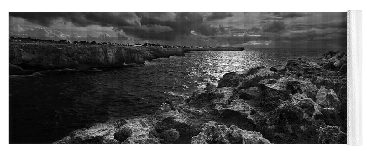 Background Yoga Mat featuring the photograph Blank and white stormy mediterranean sunrise in contrast with black rocks and cliffs in Menorca by Pedro Cardona Llambias