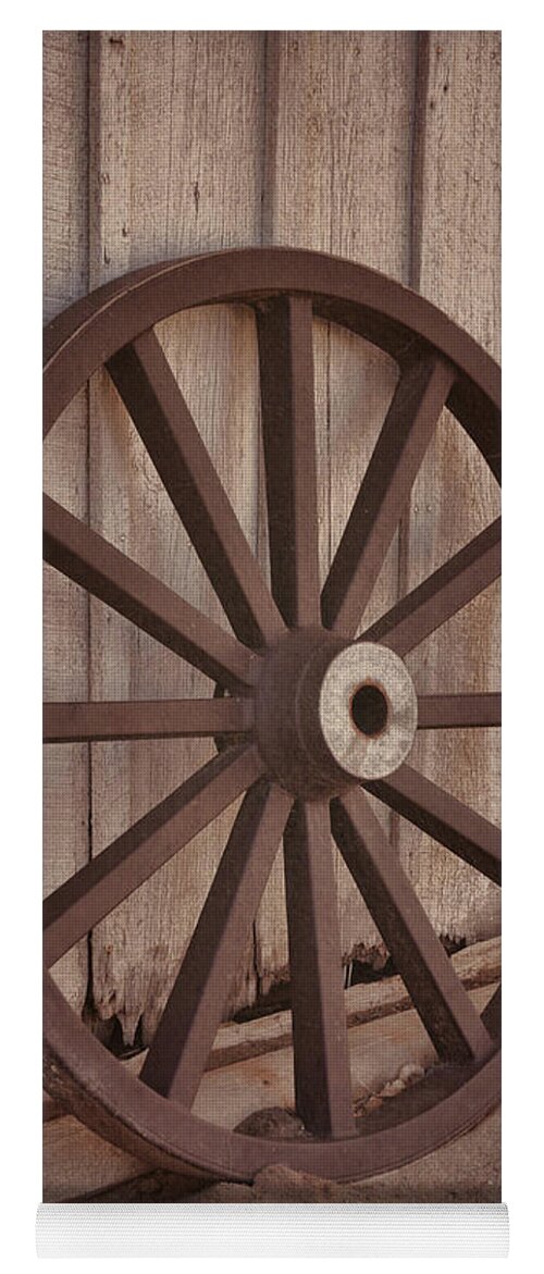 Old Yoga Mat featuring the photograph An Old Wagon Wheel by Donna Greene