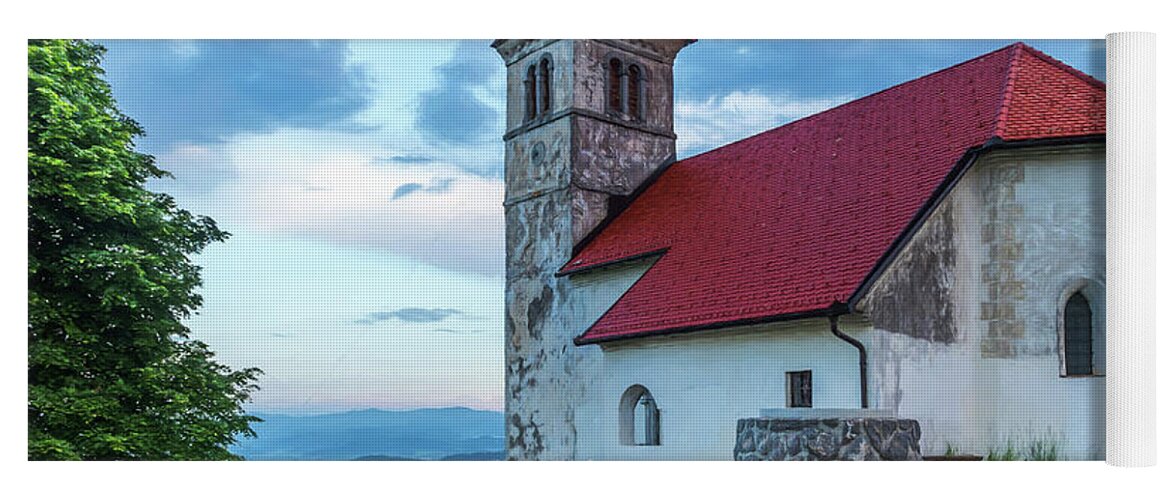 Europe Yoga Mat featuring the photograph A red roof church in Ljubjliana. by Usha Peddamatham