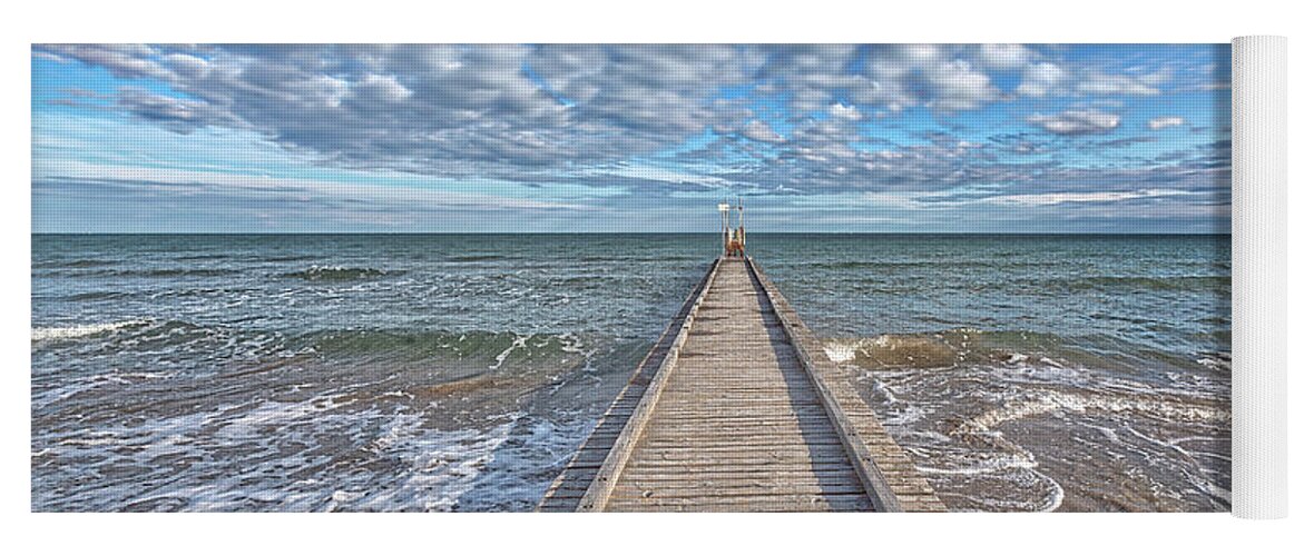Blue Yoga Mat featuring the photograph A dock leads to the mediterranean sea at the beach of Lido die Jesolo, Italy by Gina Koch
