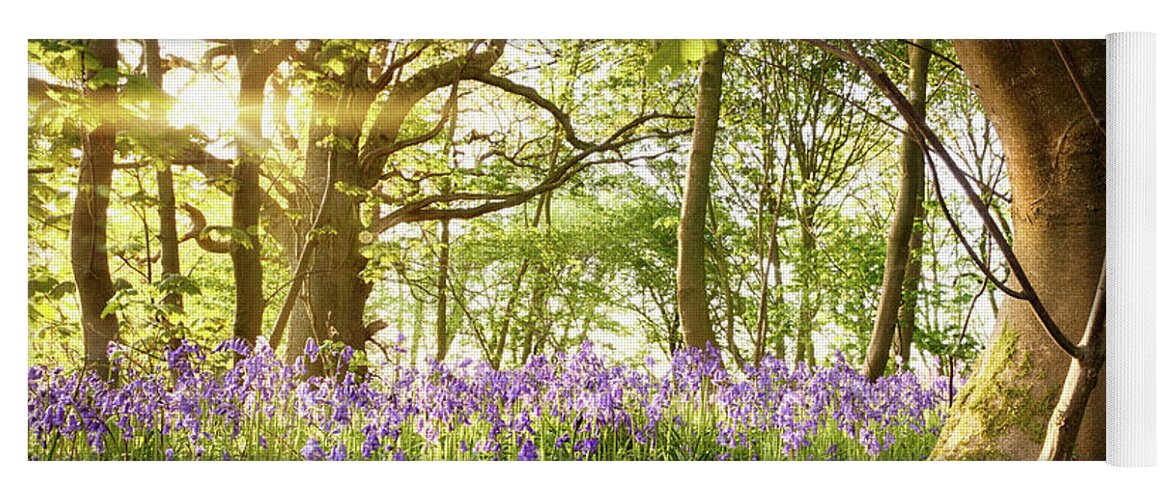 Forest Yoga Mat featuring the photograph Bent tree in bluebell forest by Simon Bratt