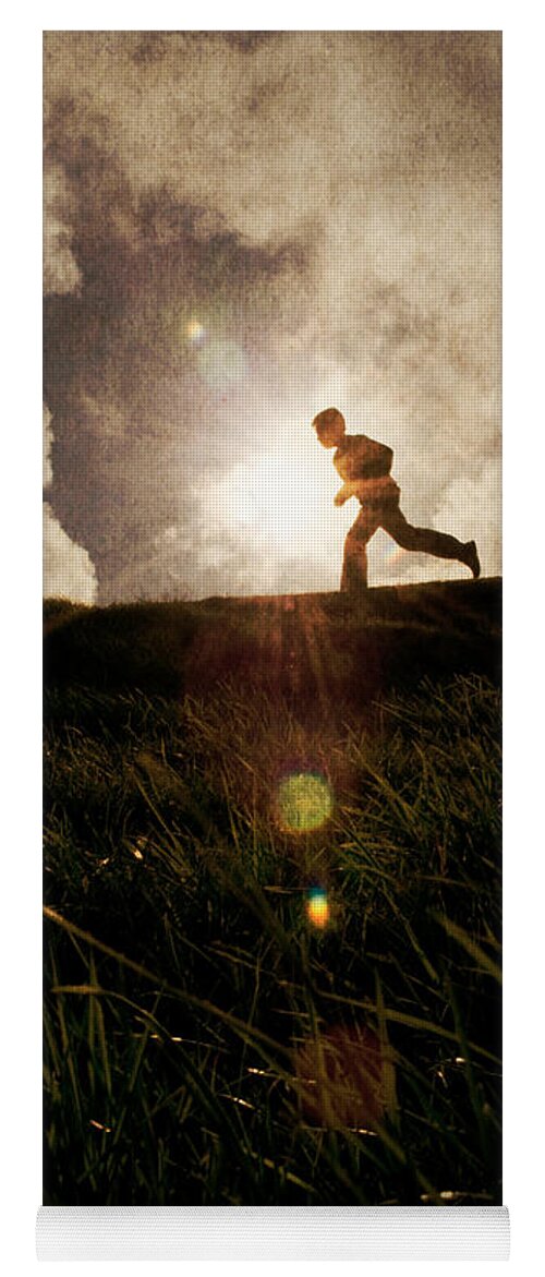 Boy Yoga Mat featuring the photograph Boy running by Clayton Bastiani