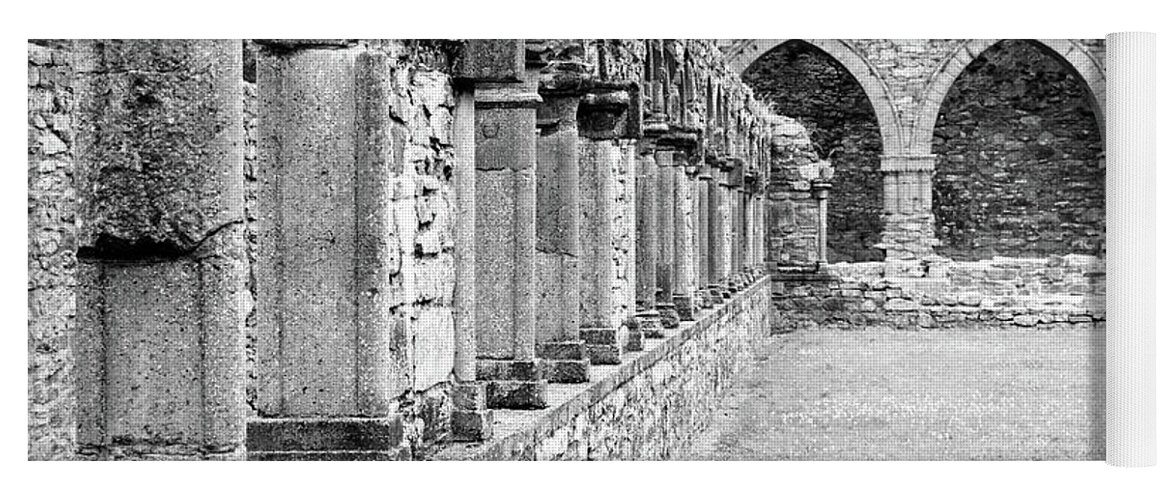 Travelpixpro Ireland Yoga Mat featuring the photograph Ireland Jerpoint Abbey Cloister Arcade Columns Irish Churches County Kilkenny Black and White by Shawn O'Brien