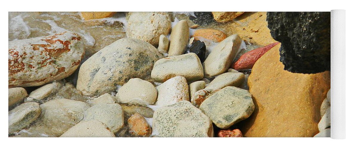  Multi Colored Beach Rocks Are Washed In A Wave At The Ocean Edge Yoga Mat featuring the photograph multi colored Beach rocks by Priscilla Batzell Expressionist Art Studio Gallery