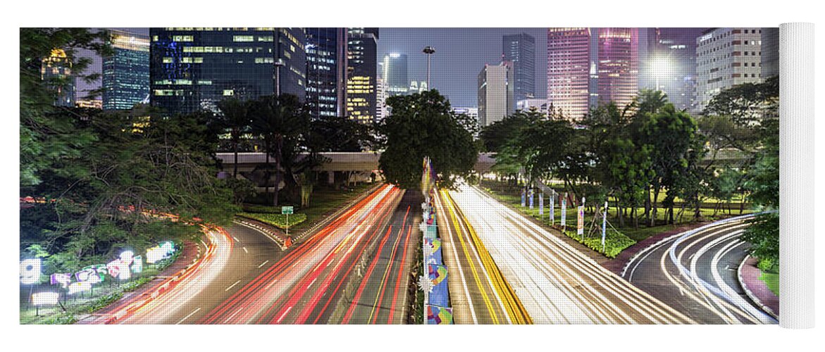 Capital Cities Yoga Mat featuring the photograph Traffic night rush in Jakarta, Indonesia capital city. by Didier Marti