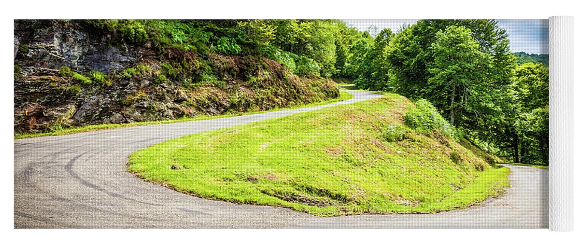 Boussenac Yoga Mat featuring the photograph Winding road with sharp curve going up the mountain by Semmick Photo