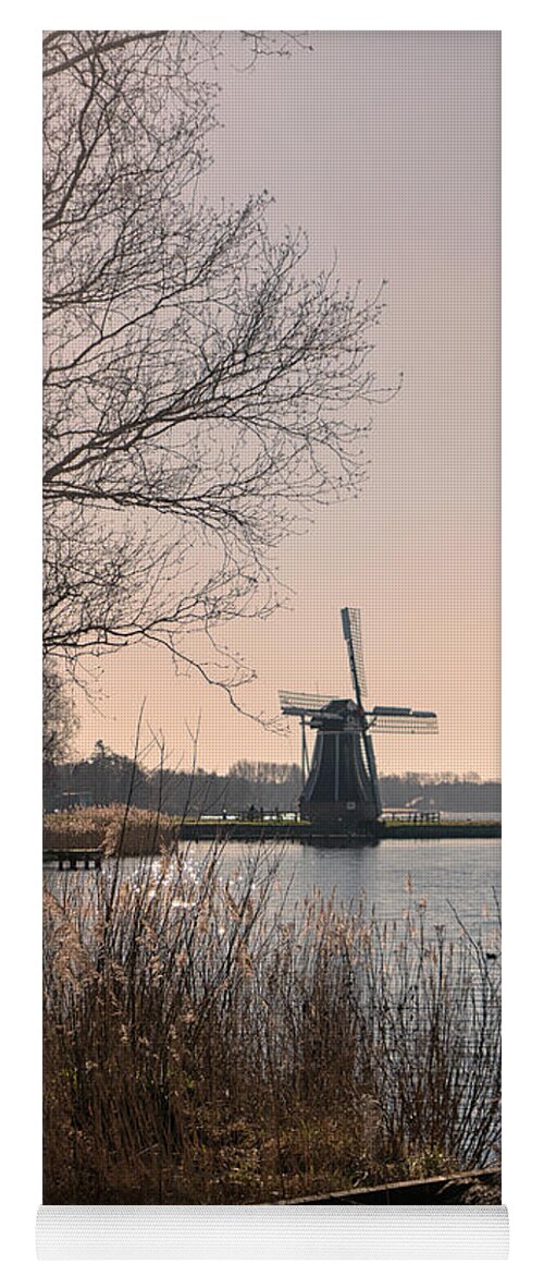 Blue Yoga Mat featuring the photograph Windmill on a lake in the Netherlands by Patricia Hofmeester
