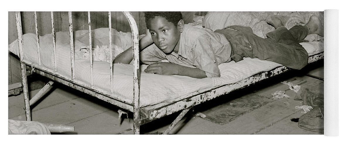 African Yoga Mat featuring the painting African American Boy resting on bed in attic of sharecropper shack. New Madrid County, Missouri by 
