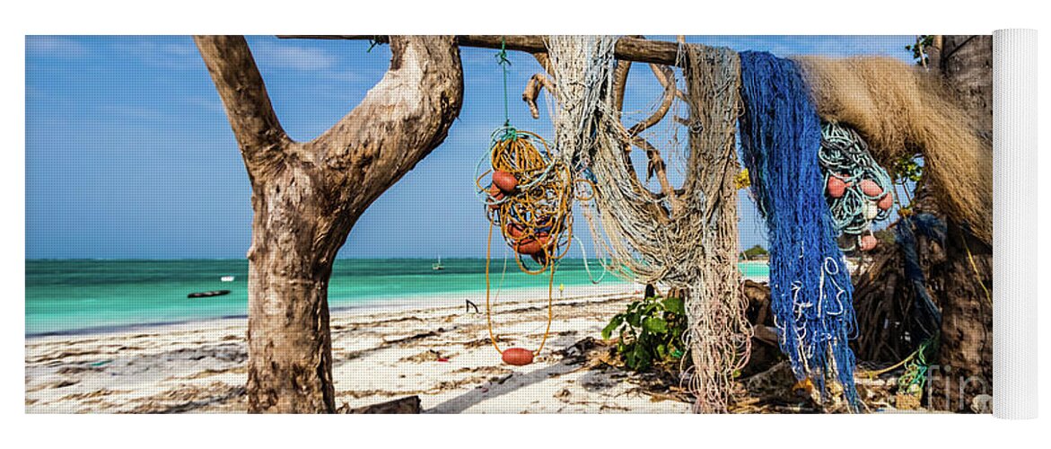 Beach Yoga Mat featuring the photograph Fishing nets drying on the beach by Lyl Dil Creations