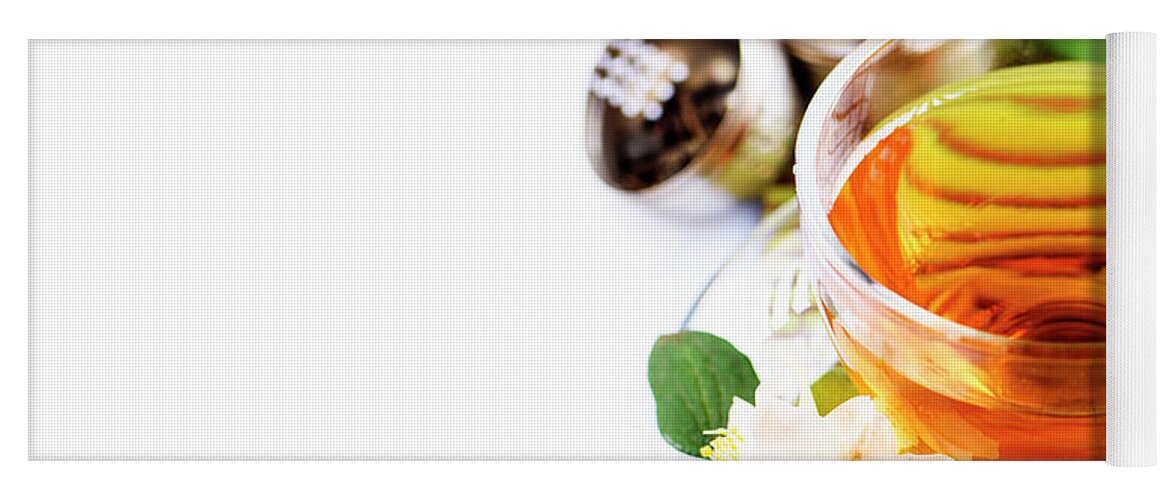 Tea Yoga Mat featuring the photograph Herbal green tea with jasmine flower in transparent teacup borde by Jelena Jovanovic