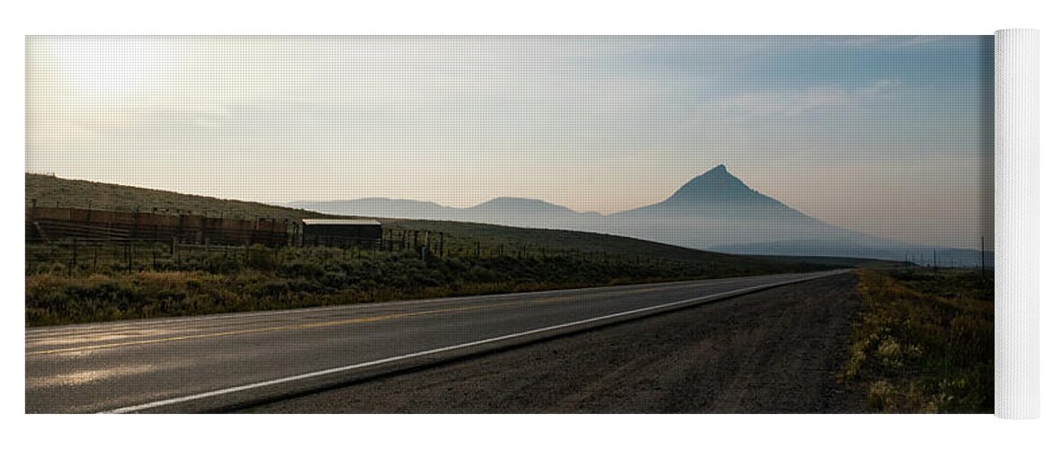 Rural Yoga Mat featuring the photograph Road through the Rockies by Nicole Lloyd