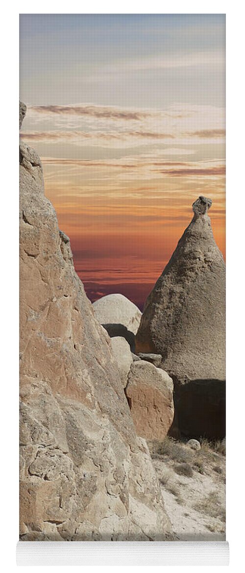 Volcanic Yoga Mat featuring the photograph Sunset on fairy chimney balanced rock formations by Steve Estvanik