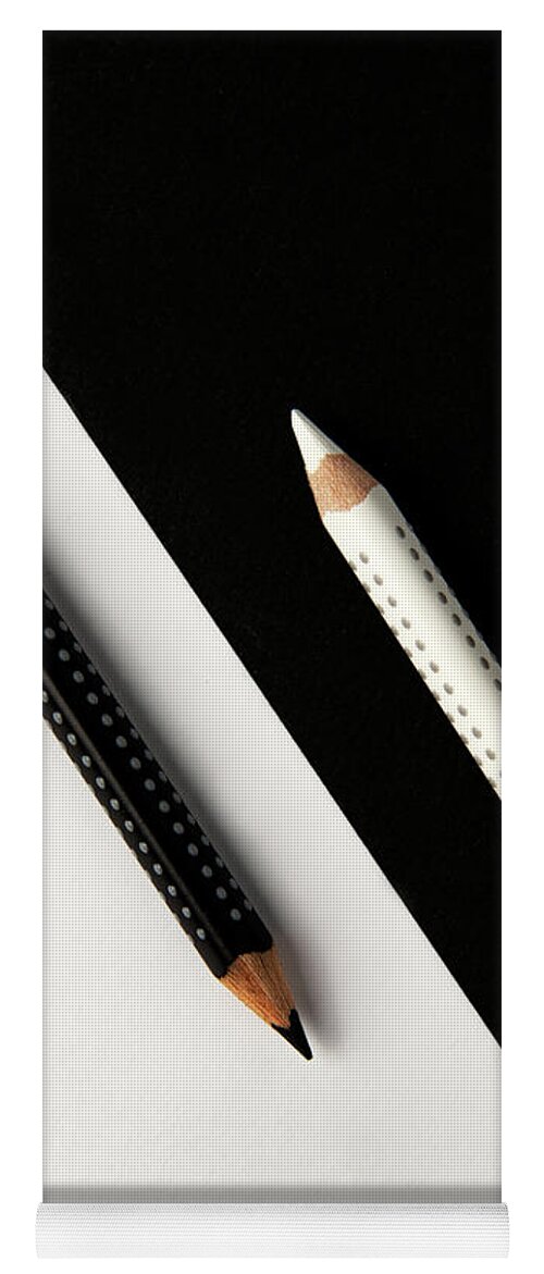 Pencil Yoga Mat featuring the photograph Two drawing pencils on a black and white surface. by Michalakis Ppalis