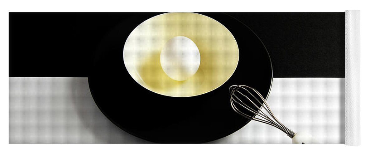 Egg Yoga Mat featuring the photograph White egg on a yellow bowl. by Michalakis Ppalis