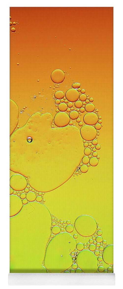 Connection Yoga Mat featuring the photograph Bright abstract, yellow background with flying bubbles by Michalakis Ppalis