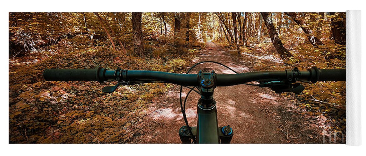 Trail Yoga Mat featuring the photograph Autumn mountain bike trail with handlebars in the foreground by Mendelex Photography