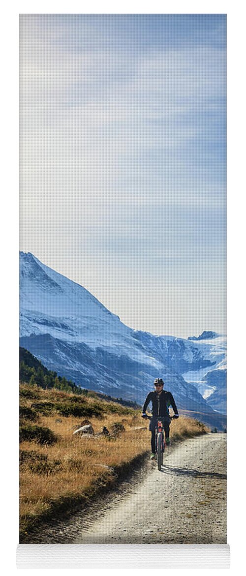 Alps Yoga Mat featuring the photograph Bicycling in the Alps by Alexey Stiop