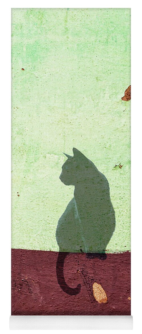 Black Yoga Mat featuring the photograph Black cat sitting on a wall by Delphimages Photo Creations