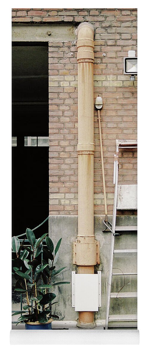Building Yoga Mat featuring the photograph Composition of building yard with plant and tools by Barthelemy De Mazenod