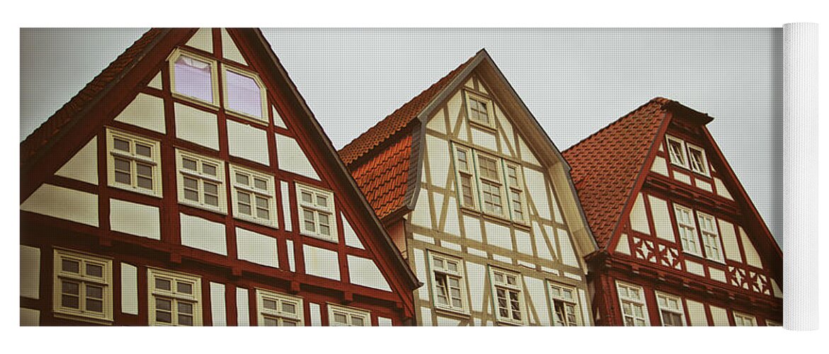 Architecture Yoga Mat featuring the photograph Cute historical half-timbered houses in Melsungen, Germany by Mendelex Photography