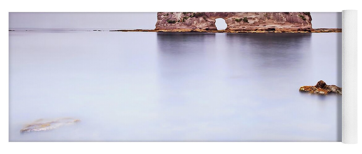 Island Yoga Mat featuring the photograph Hole island and rocks in a tropical blue ocean. Cloudy sky. by Stefano Orazzini