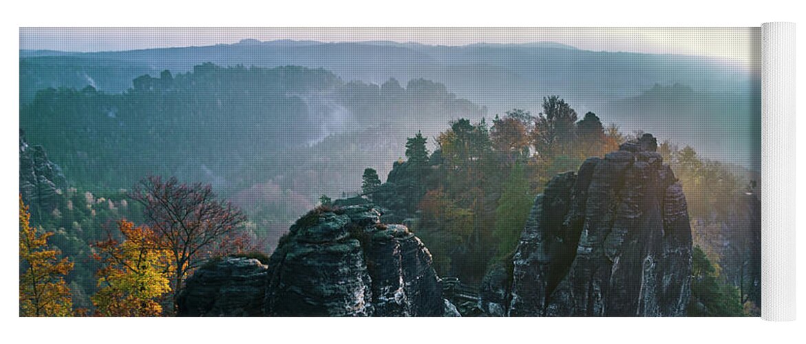 Saxon Switzerland Yoga Mat featuring the photograph Morning mist on the Bastei rocks in Saxon Switzerland by Sun Travels