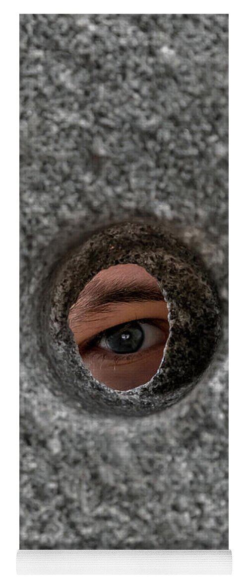Anxiety Yoga Mat featuring the photograph Open Eye Looking Through Round Hole In Stone Wall by Andreas Berthold