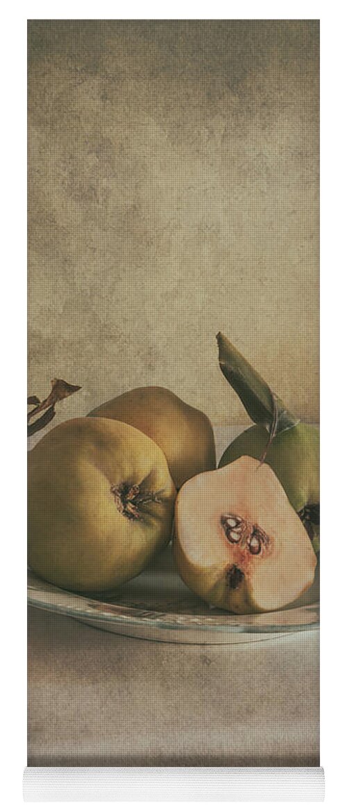 Still Life Yoga Mat featuring the photograph Plate of fresh quince by Jaroslaw Blaminsky