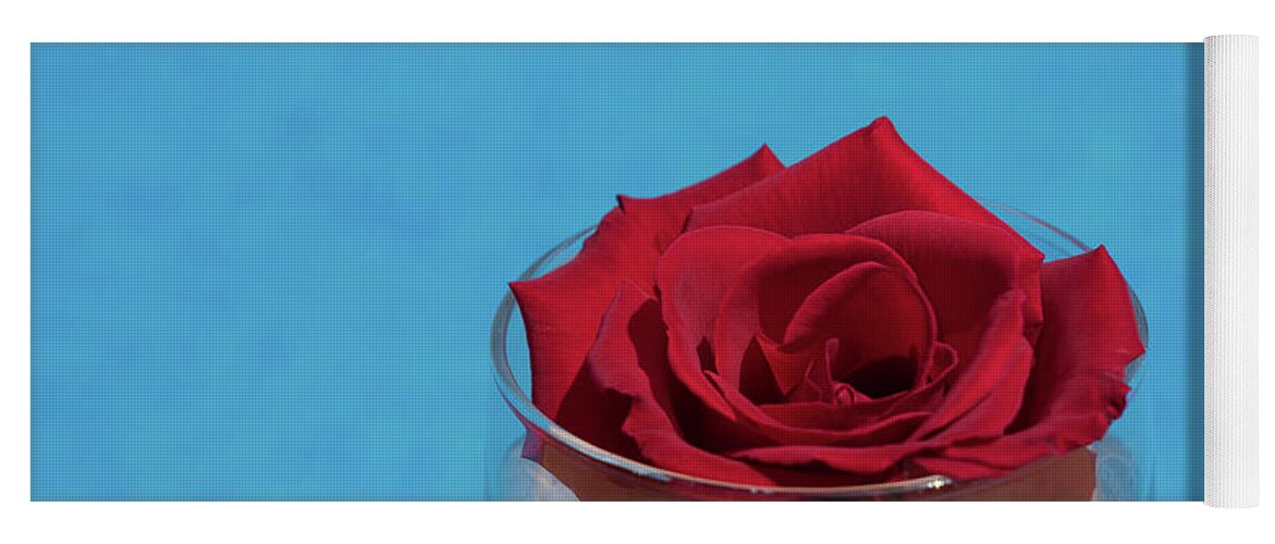 Red Rose Yoga Mat featuring the photograph Red rose blossom and blue water by Adriana Mueller