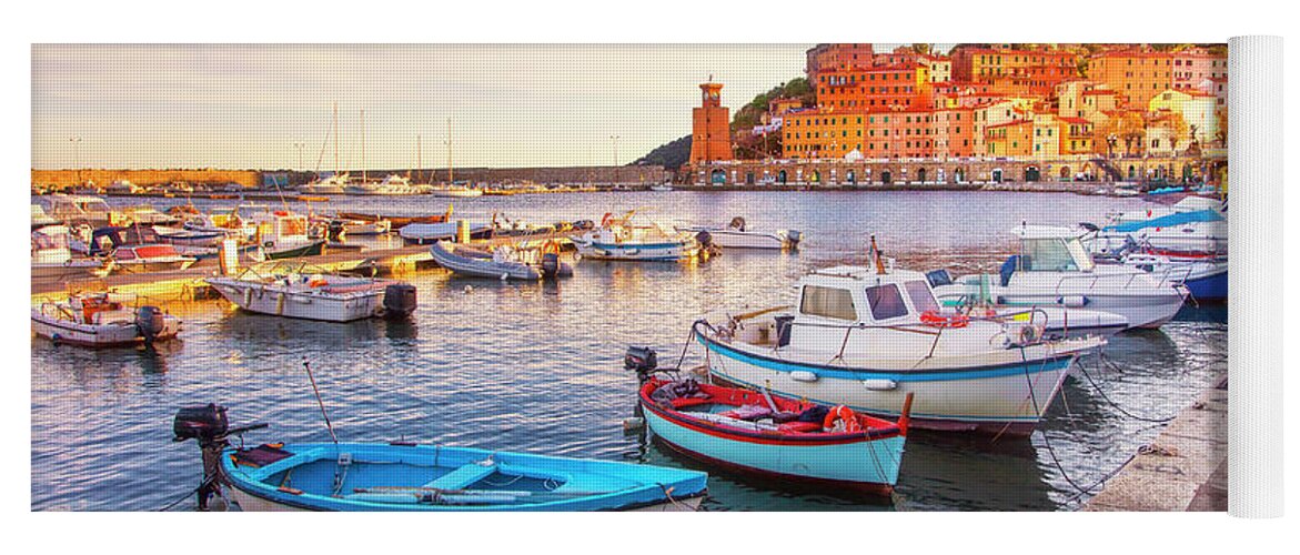 Elba Yoga Mat featuring the photograph Rio Marina boats and lighthouse. Elba island by Stefano Orazzini