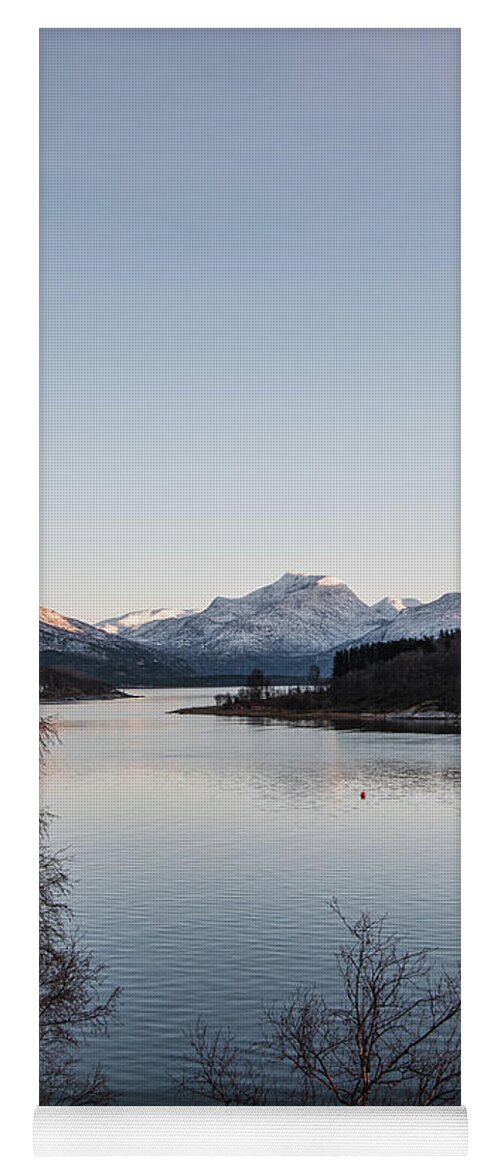 Christmas Yoga Mat featuring the photograph The snowy hills are illuminated by the last vestige of orange sunlight. Narvik, Norway by Vaclav Sonnek