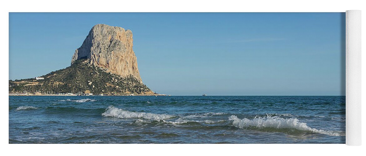 Sandy Beach Yoga Mat featuring the photograph The south face of the Penon de Ifach in Calpe by Adriana Mueller
