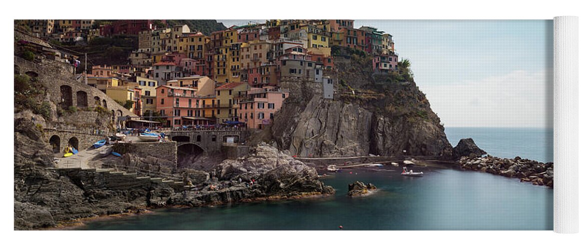 Cinque Terre Yoga Mat featuring the photograph Village of Manarola with colourful houses at the edge of the cliff Riomaggiore, Cinque Terre, Liguria, Italy by Michalakis Ppalis