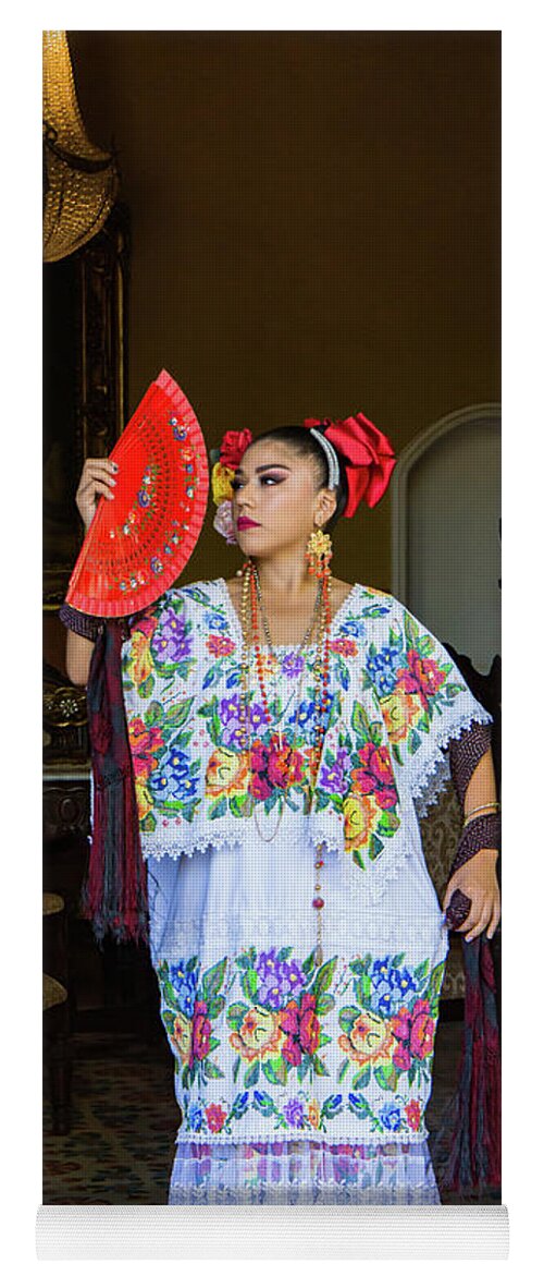 woman in traditional Mexican embroidered huipil tunic and dress
