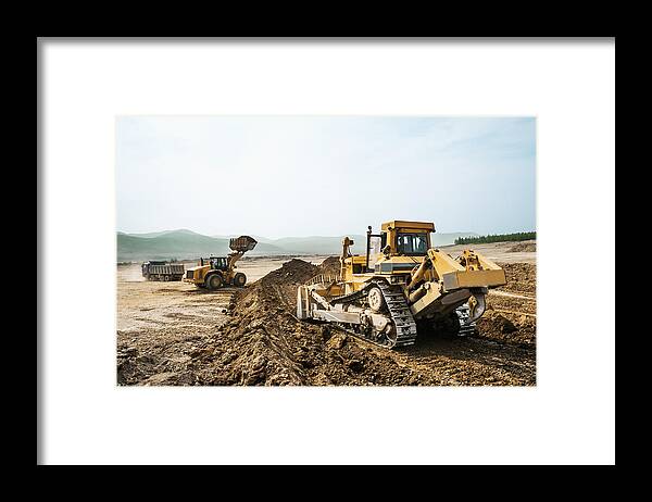 Environmental Conservation Framed Print featuring the photograph Earthwork, working machinery on a summer day #1 by Pro-syanov