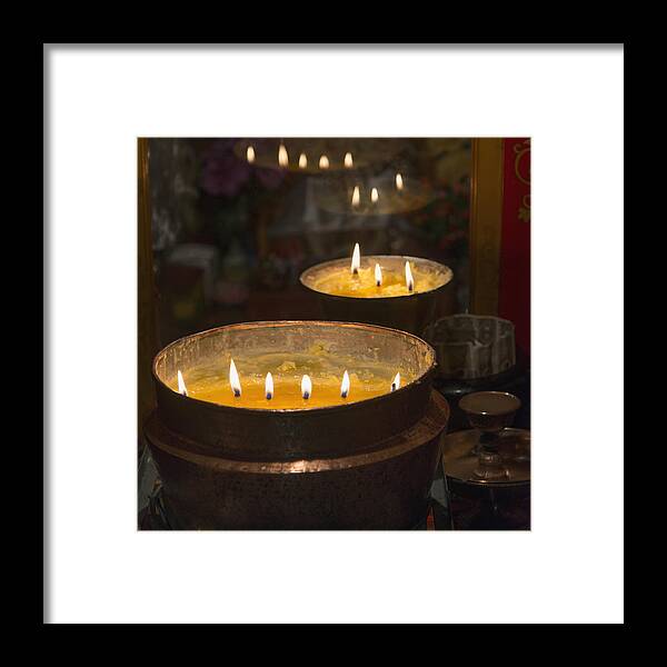 Barkhor Framed Print featuring the photograph Flames Burning In A Row In Large Bronze #1 by Keith Levit