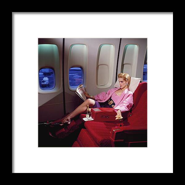 Indoors Framed Print featuring the photograph Model Wearing Pink Jacket On Airplane by Horst P. Horst
