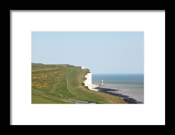 Tranquility Framed Print featuring the photograph People Walking On Beachy Head #1 by Richard Newstead