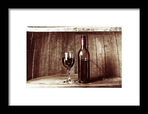 Vintage Framed Print featuring the photograph Vintage red wine in old winery cellar barrel #1 by Jorgo Photography