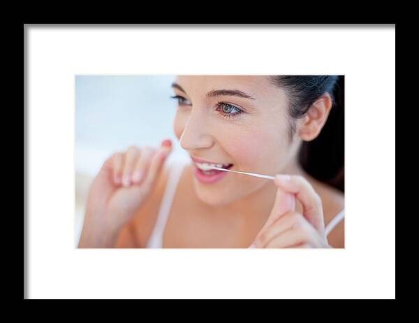 Indoors Framed Print featuring the photograph Woman Flossing Teeth #1 by Ian Hooton