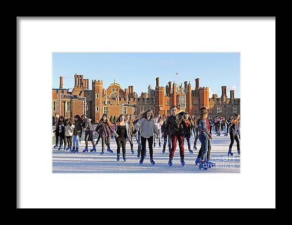 Ice Skating At Hampton Court Palace Ice Rink England Uk Framed Print featuring the photograph Ice skating at Hampton Court Palace ice rink England UK #13 by Julia Gavin